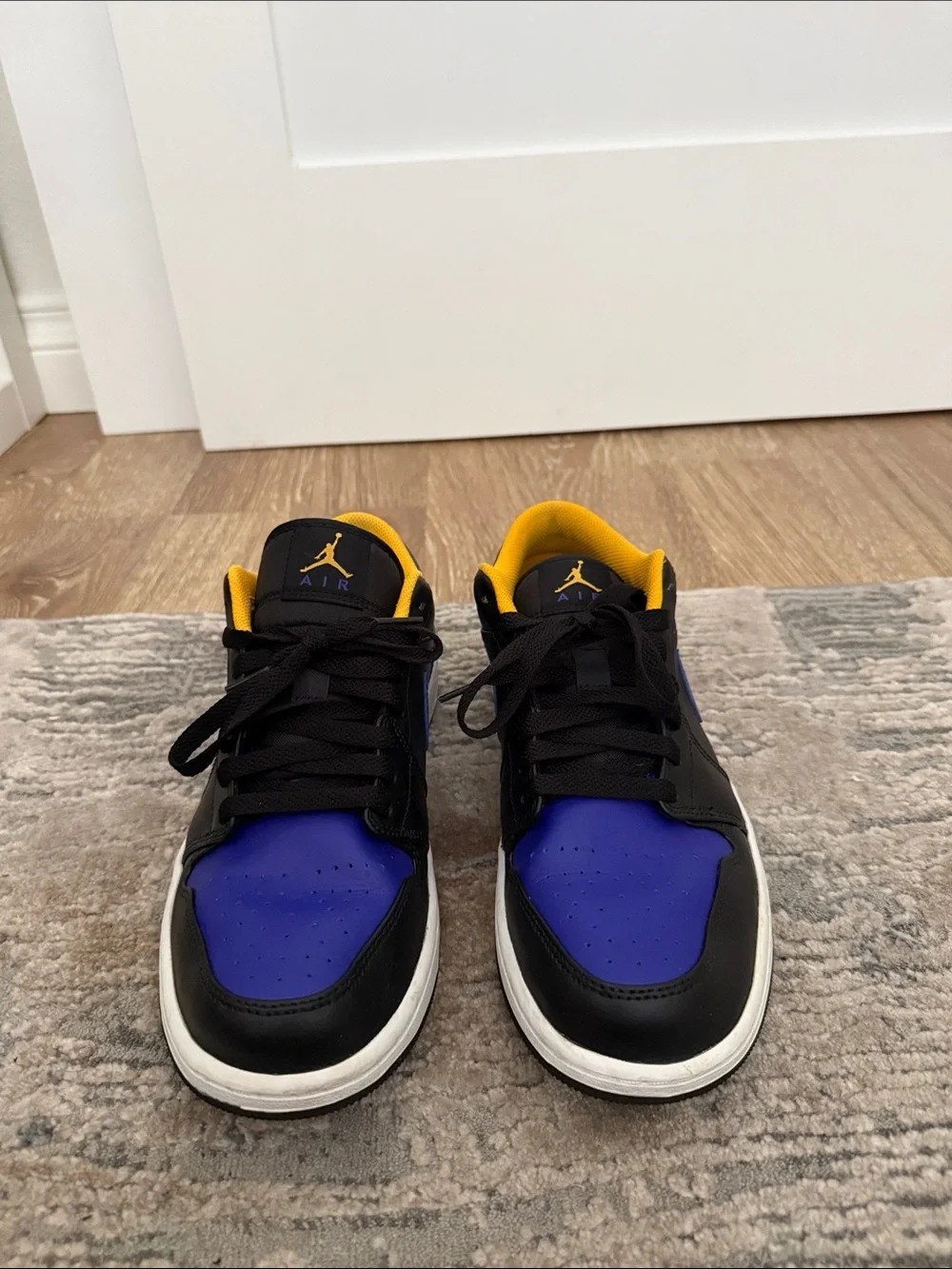 Jordan 1 Low-Top Sneakers in Black, Royal Blue & Yellow